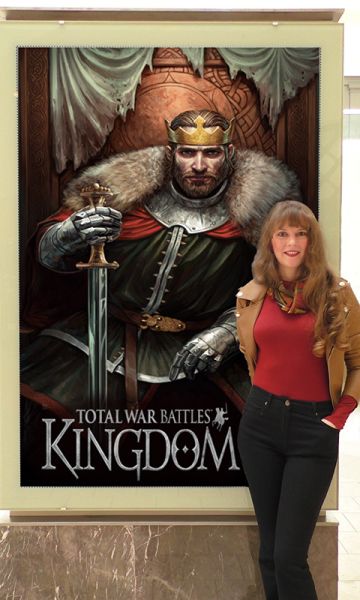 Photo of composer Winifred Phillips with Total War Battles: Kingdom display