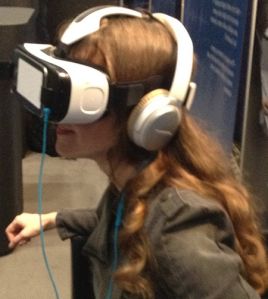 Video game composer Winifred Phillips demonstrating the Samsung Gear VR headset during the AES convention in NYC.