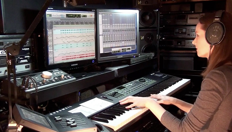 Composer Winifred Phillips working in her production studio on music for the Ultimate Trailers album (West One Music).