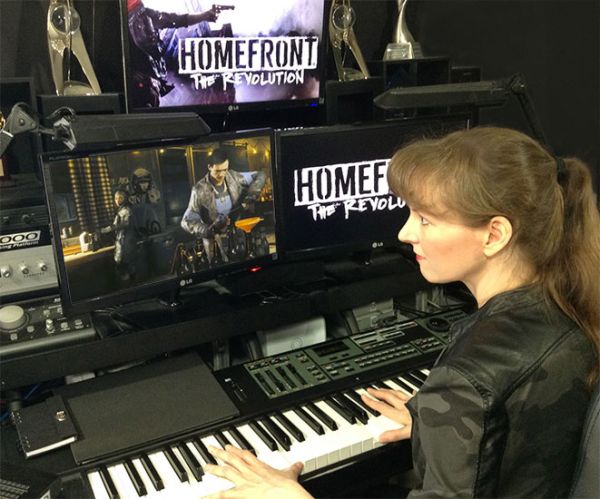 Video game composer Winifred Phillips, composing music for the triple-A first person shooter HOMEFRONT: THE REVOLUTION in her music studio.