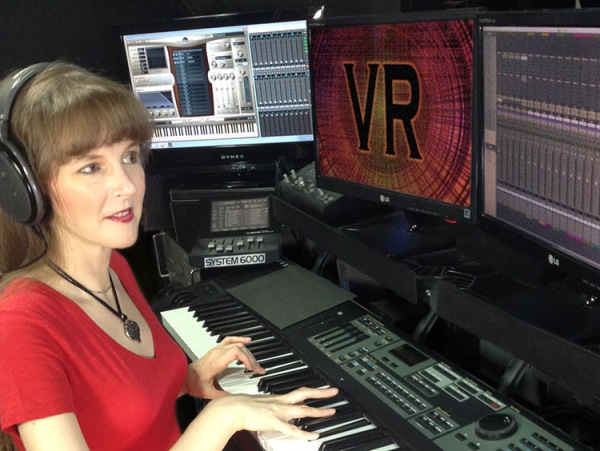 Photo of game composer Winifred Phillips in her music production studio, from the article "Video Game Music Composer: Music and Sound in VR Headphones (Part Two)"