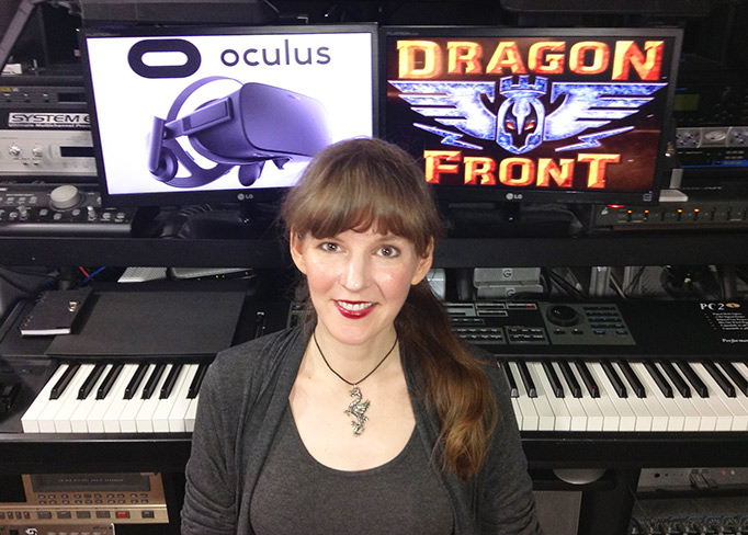Video game composer Winifred Phillips, pictured in her music studio working on the original score for the Dragon Front virtual reality game.