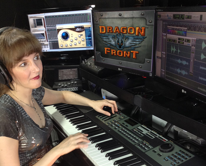 Pictured: Winifred Phillips (video game music composer) in her studio working on the music of the Dragon Front virtual reality game.