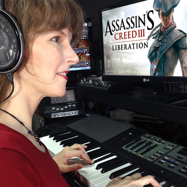Winifred Phillips, composer of video game music, shown in her studio working on the music of the Assassin's Creed Liberation video game.