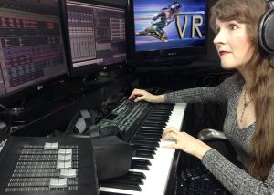 Famous video game composer Winifred Phillips works in her music production studio.