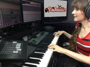 Video game music composer Winifred Phillips, pictured in her music production studio working on the music of the SimAnimals video game.