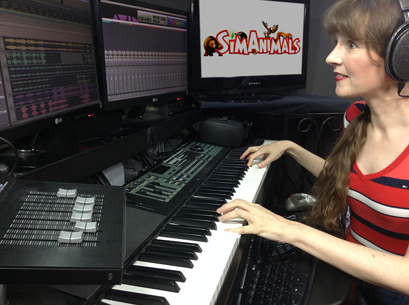 Photo of video game composer Winifred Phillips, working in her music production studio on the music of the SimAnimals video game.