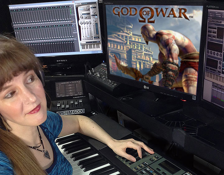 In this article written for video game composers, Winifred Phillips (composer of music for God of War) is here pictured working in her music production studio.