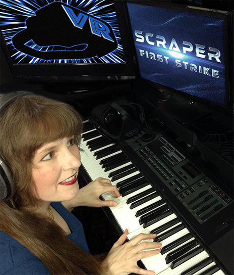 In this article written for video game composers, Winifred Phillips (video game composer) is here pictured working in her music production studio on the music for the Scraper: First Strike game, developed for popular VR gaming platforms (PSVR, Oculus Rift, HTC Vive).