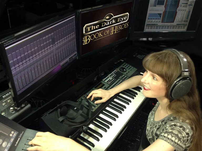 This photo shows video game composer Winifred Phillips working in her music production studio on music for the latest game in The Dark Eye franchise. Phillips has composed music for titles in five of the most popular franchises in gaming (Assassin's Creed, God of War, Total War, LittleBigPlanet, The Sims).