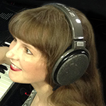 Photo of video game composer Winifred Phillips in her game composers production studio.
