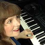 Award-winning video game composer Winifred Phillips works in her music production studio.