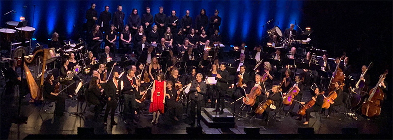 Photo of game music composer Winifred Phillips onstage during the Montreal performance of the Assassin's Creed Symphony worldwide concert tour.