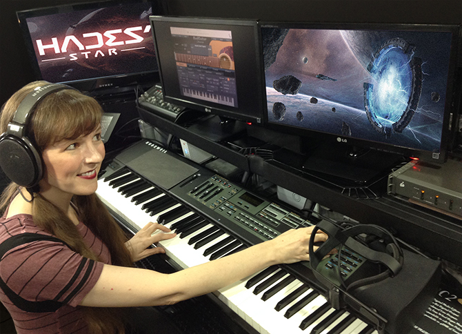 Working on the music of the Hades' Star video game, video game composer Winifred Phillips is here pictured in her music studio at Generations Productions.