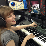 Popular game music composer Winifred Phillips works in her music production studio.